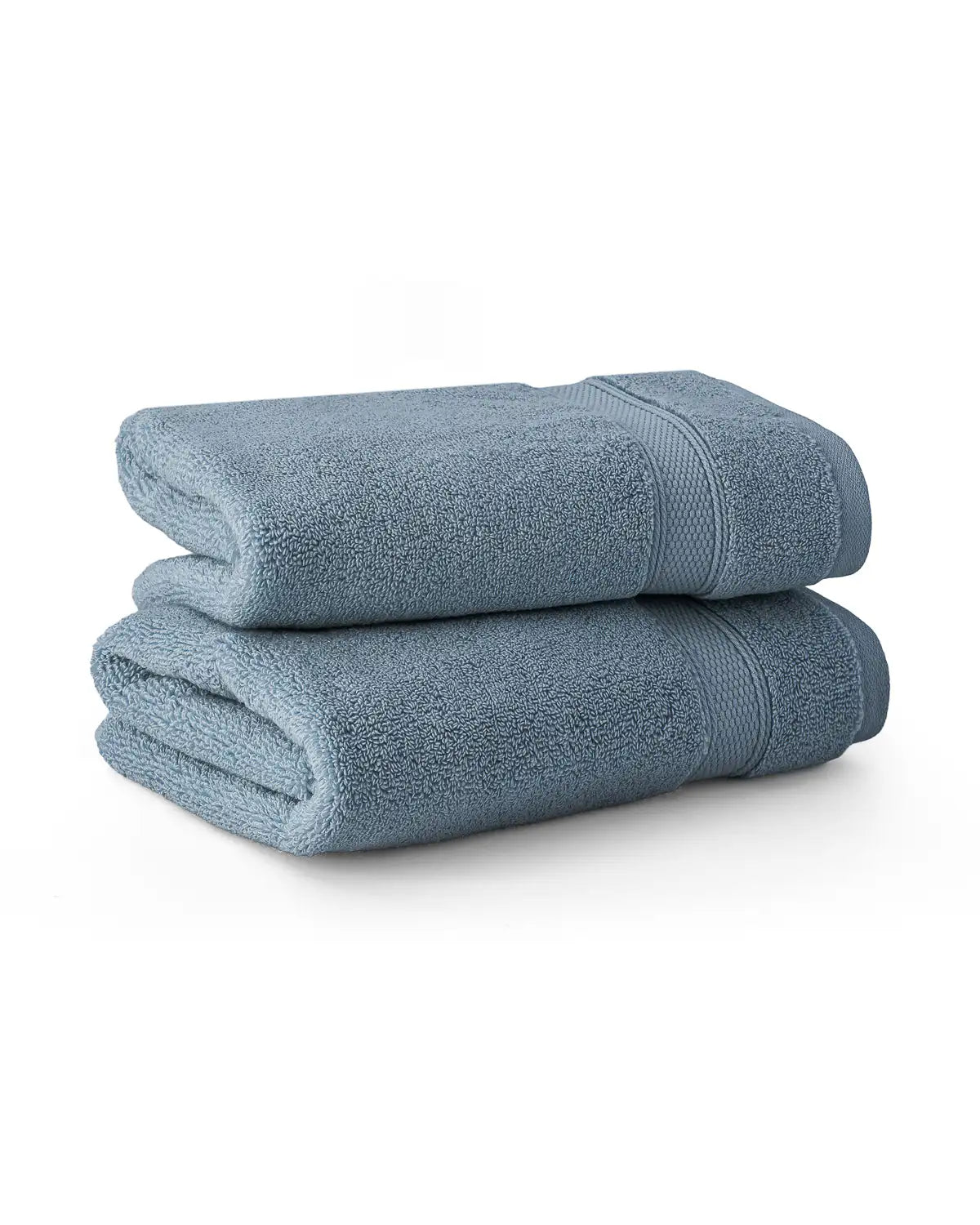 Two folded blue shadow modal cotton premium towels on a white background