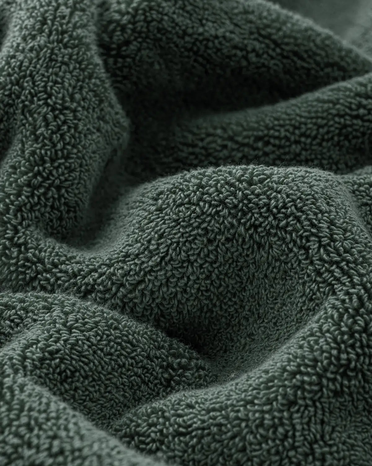 Close-up of pine green textured modal cotton towel