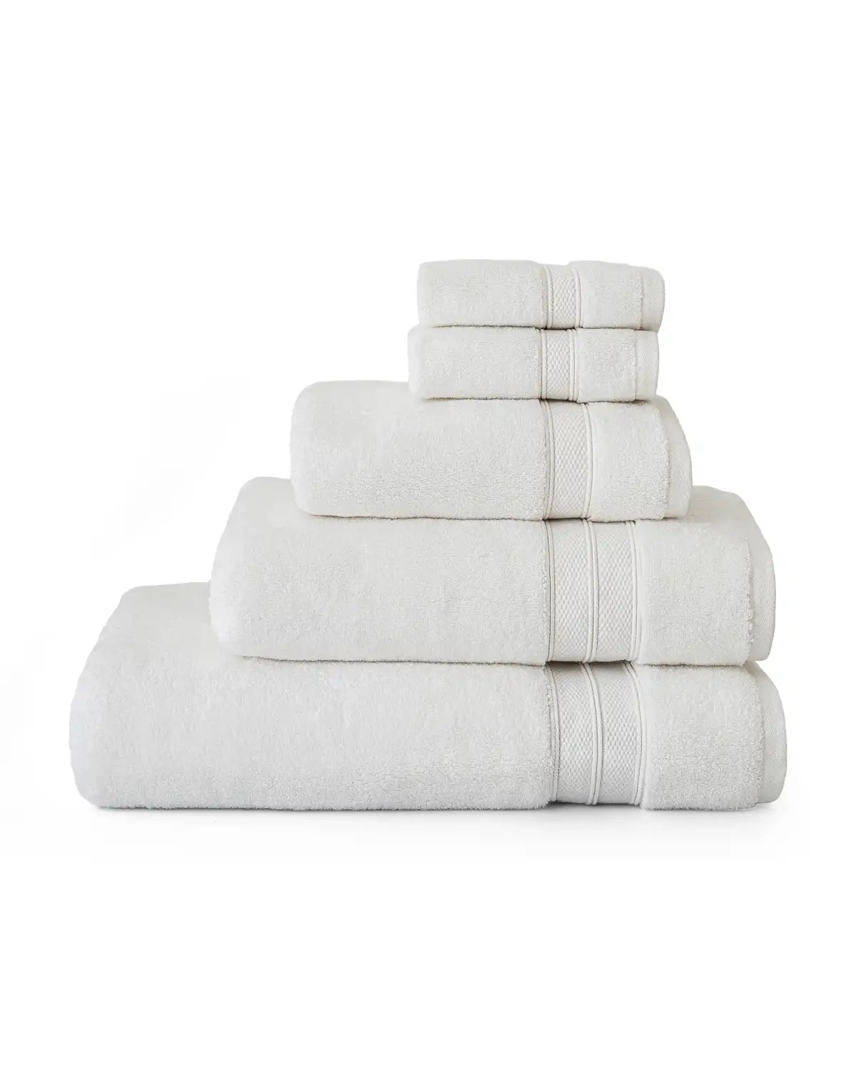 Stack of white modal towels on a white background
