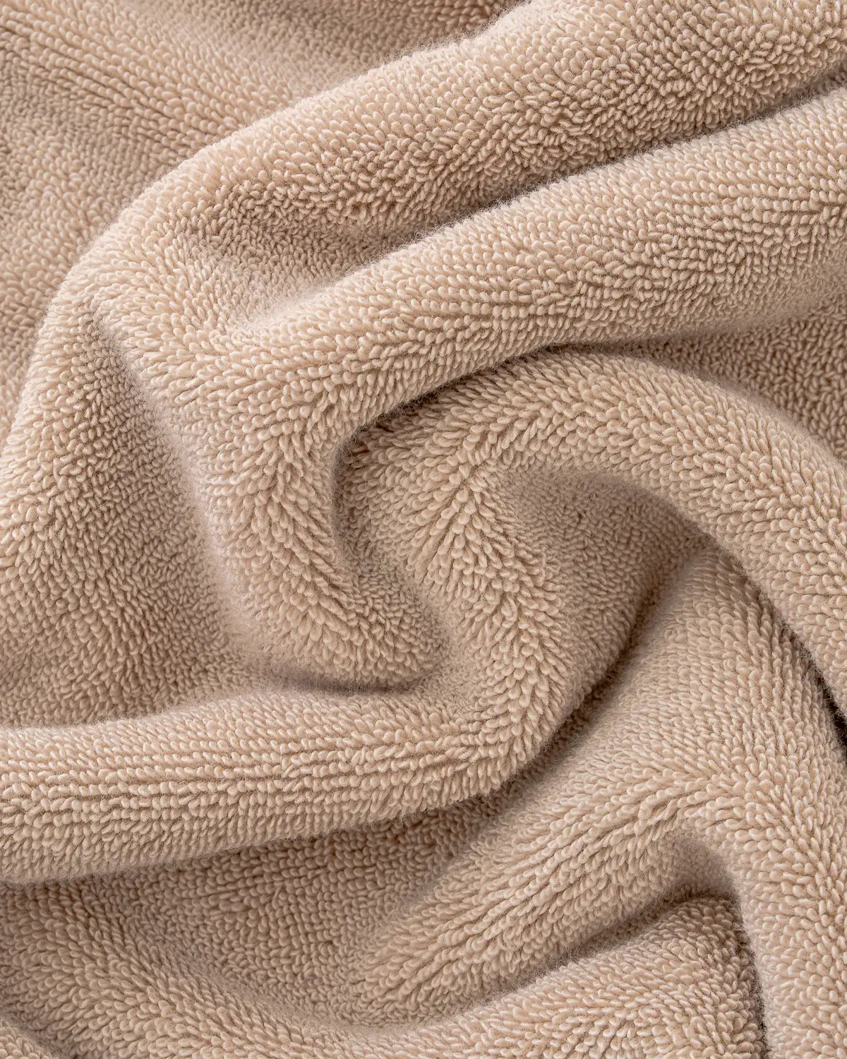 Close-up of sandshell Turkish cotton towel with a soft texture