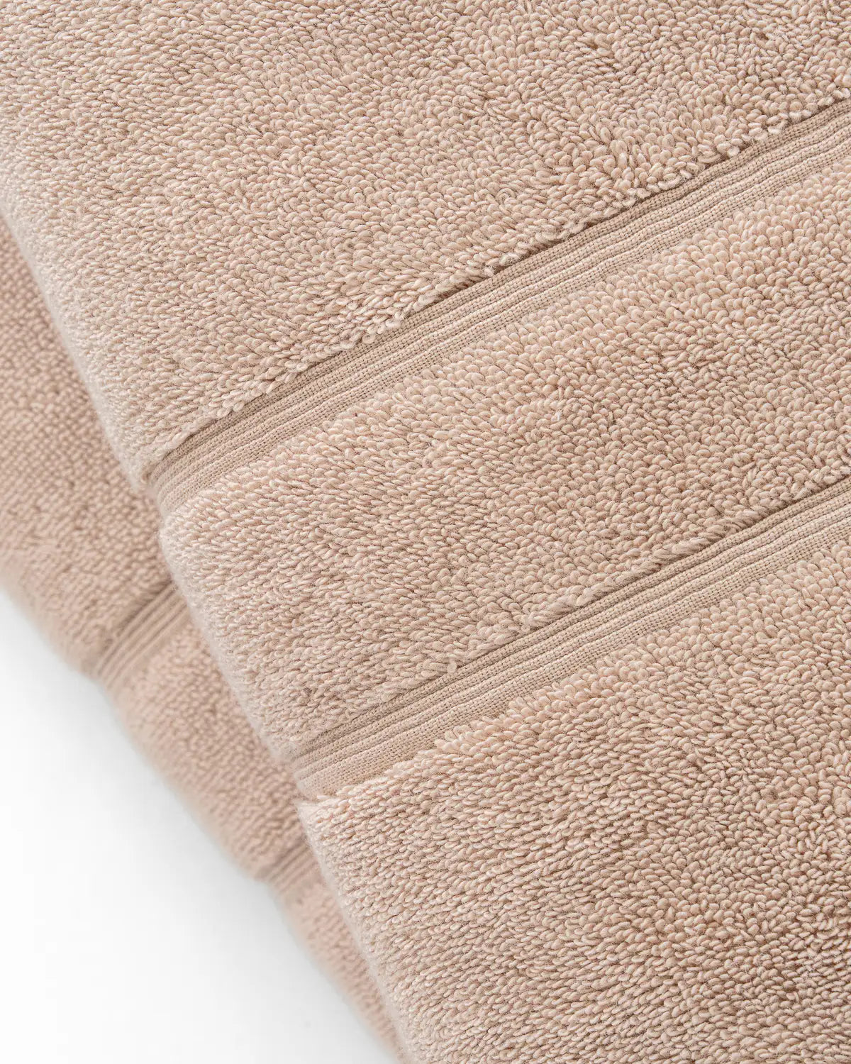 Close-up view of a classic sandshell Turkish towel pattern.