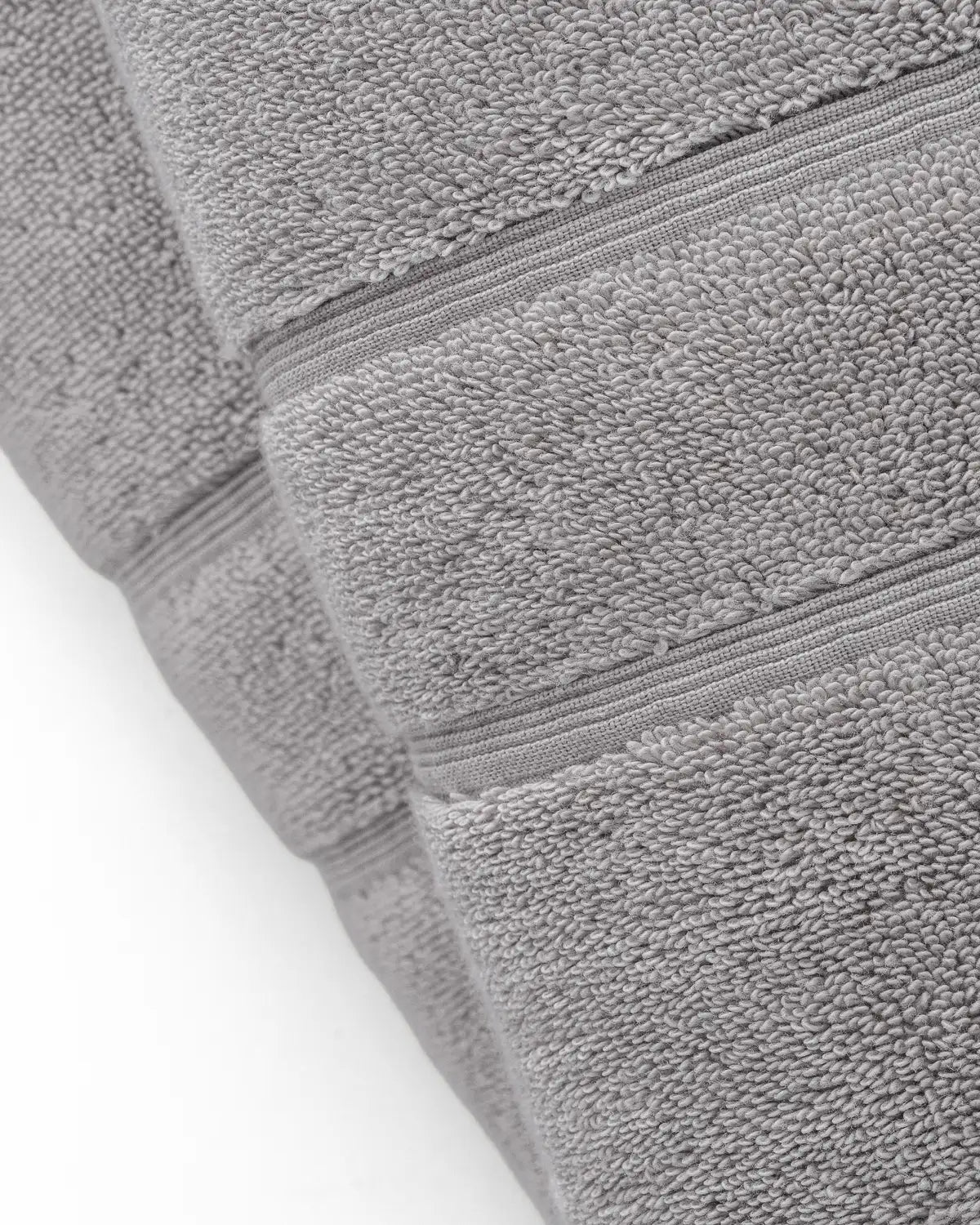 A close-up of a classic Turkish hand towel against a white background.