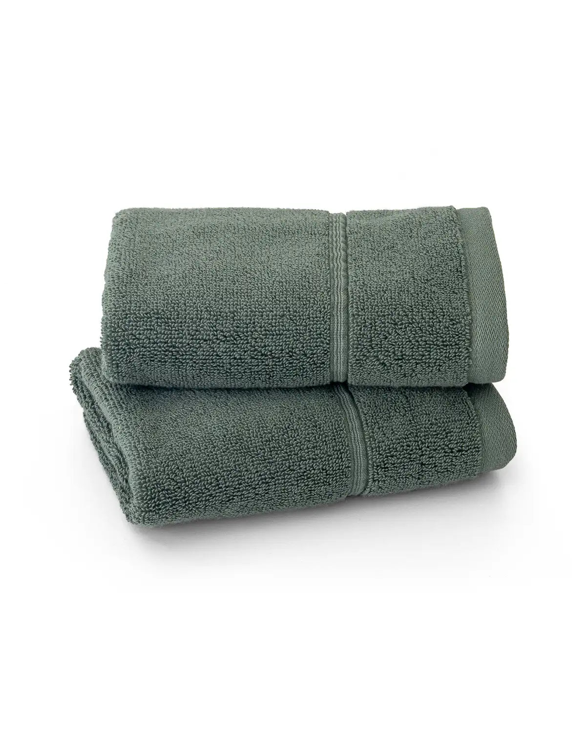 Two pine green classic Turkish washcloth stacked on a white background