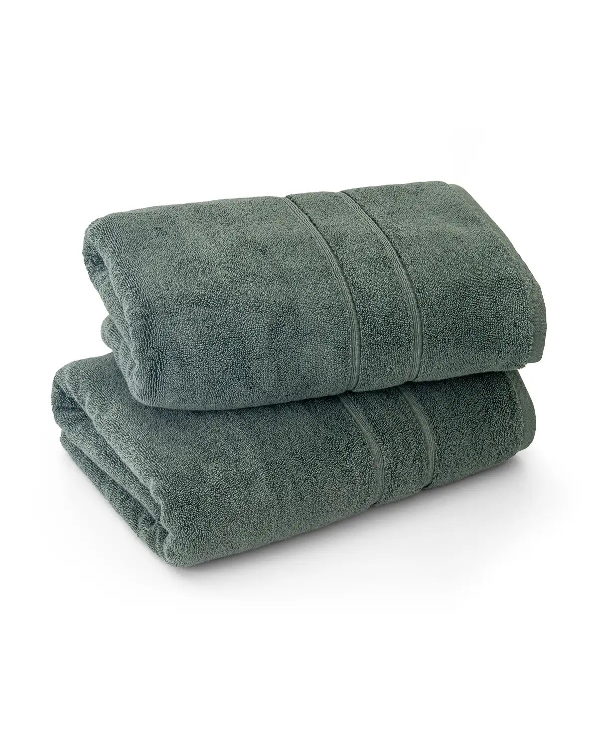 Two pine green classic Turkish towels stacked on a white background