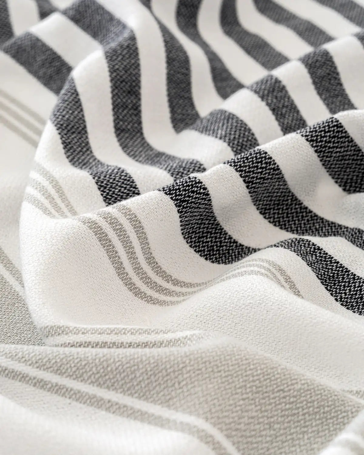 Close-up of a fabric with Ultra-Lightweight Multi-Purpose Beach Towel striped pattern