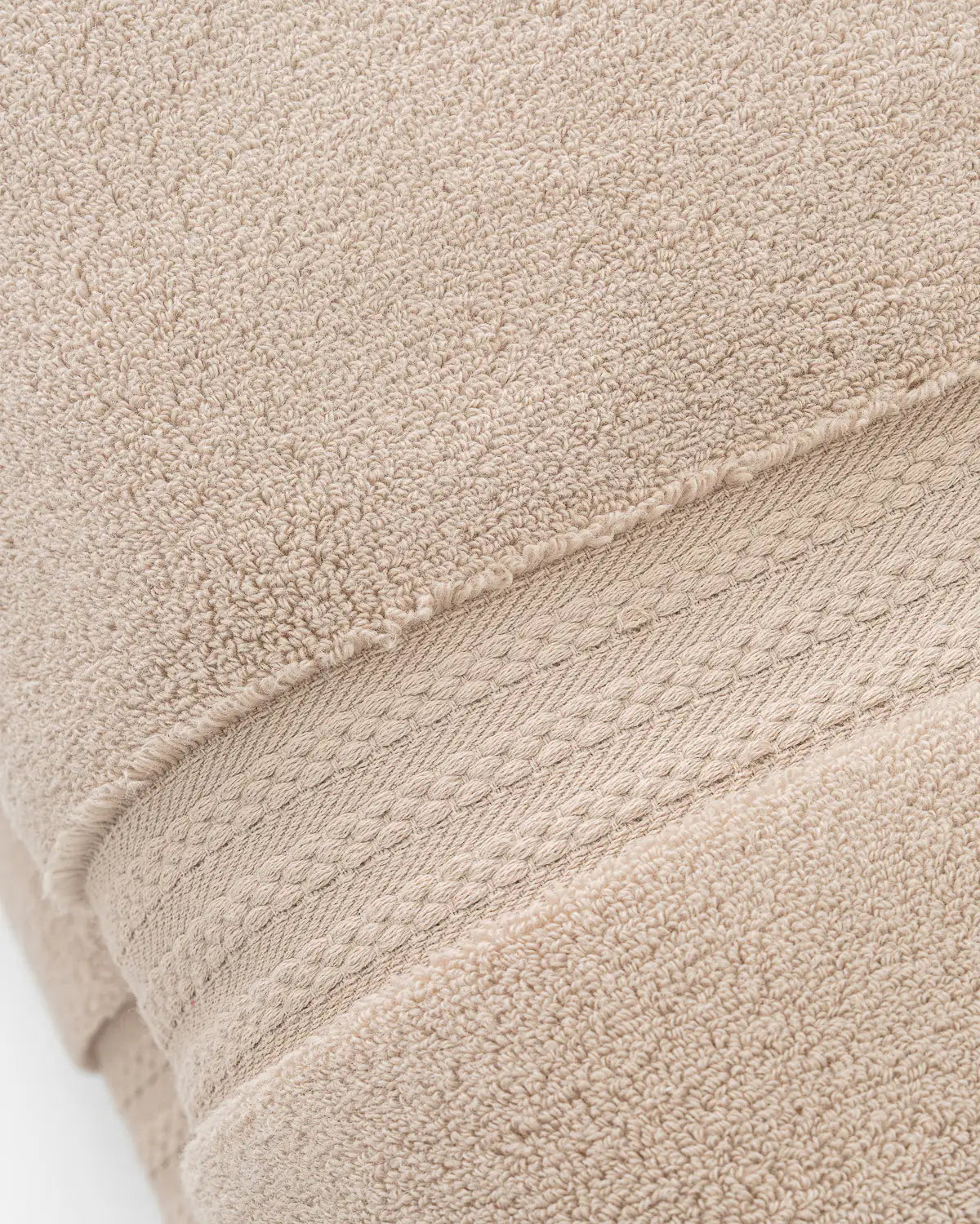 Close-up of a sandshell ultrasoft premium cotton towel with textured surface