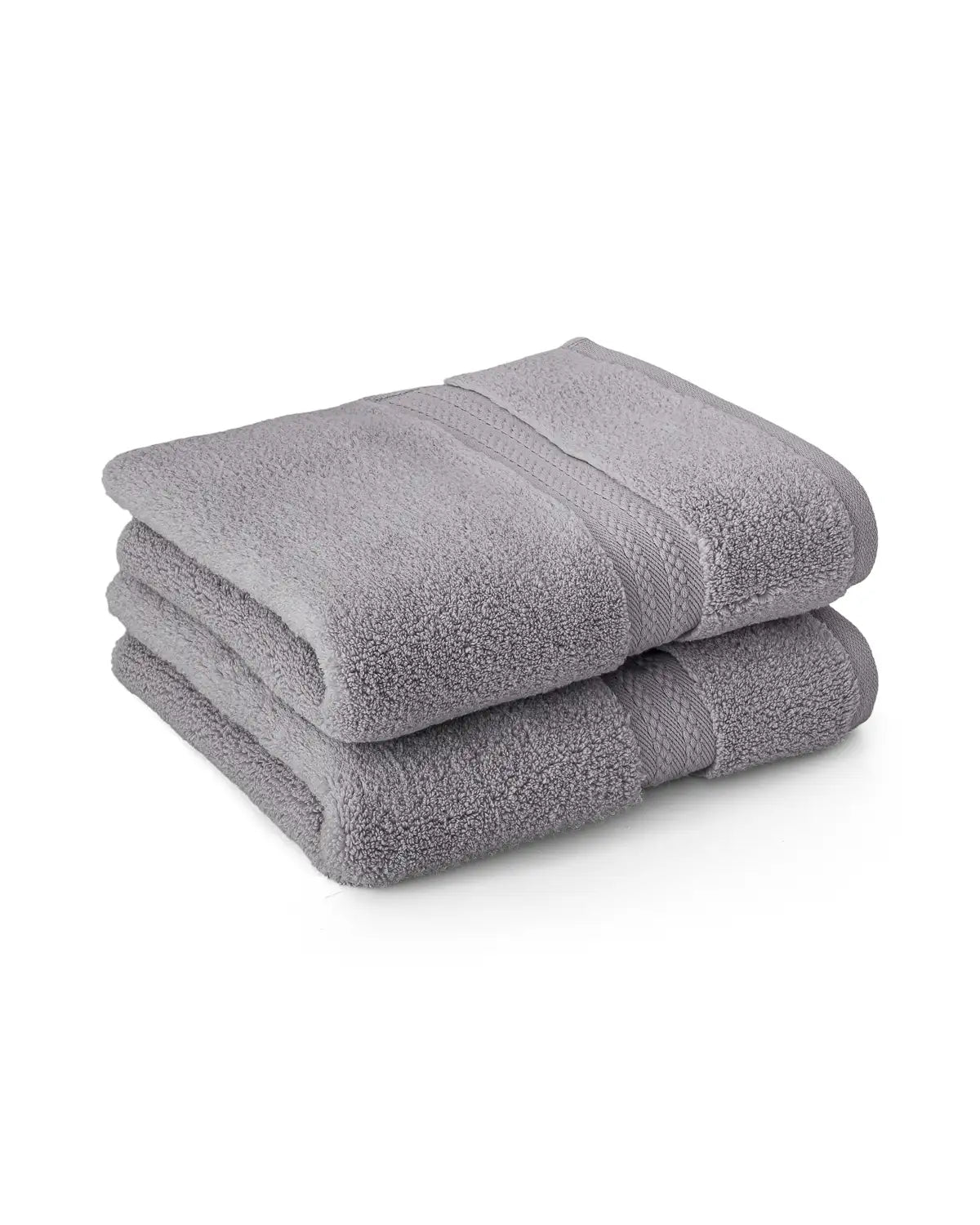 Two folded opal gray color ultrasoft cotton hand towels on a white background
