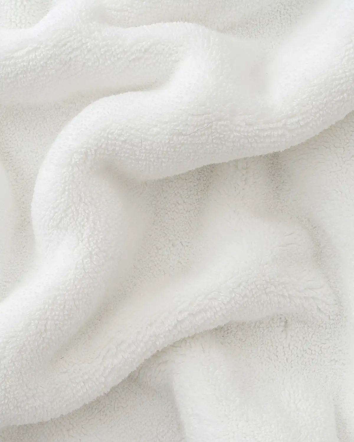 Close-up of white ultrasoft premium cotton towel with a soft texture