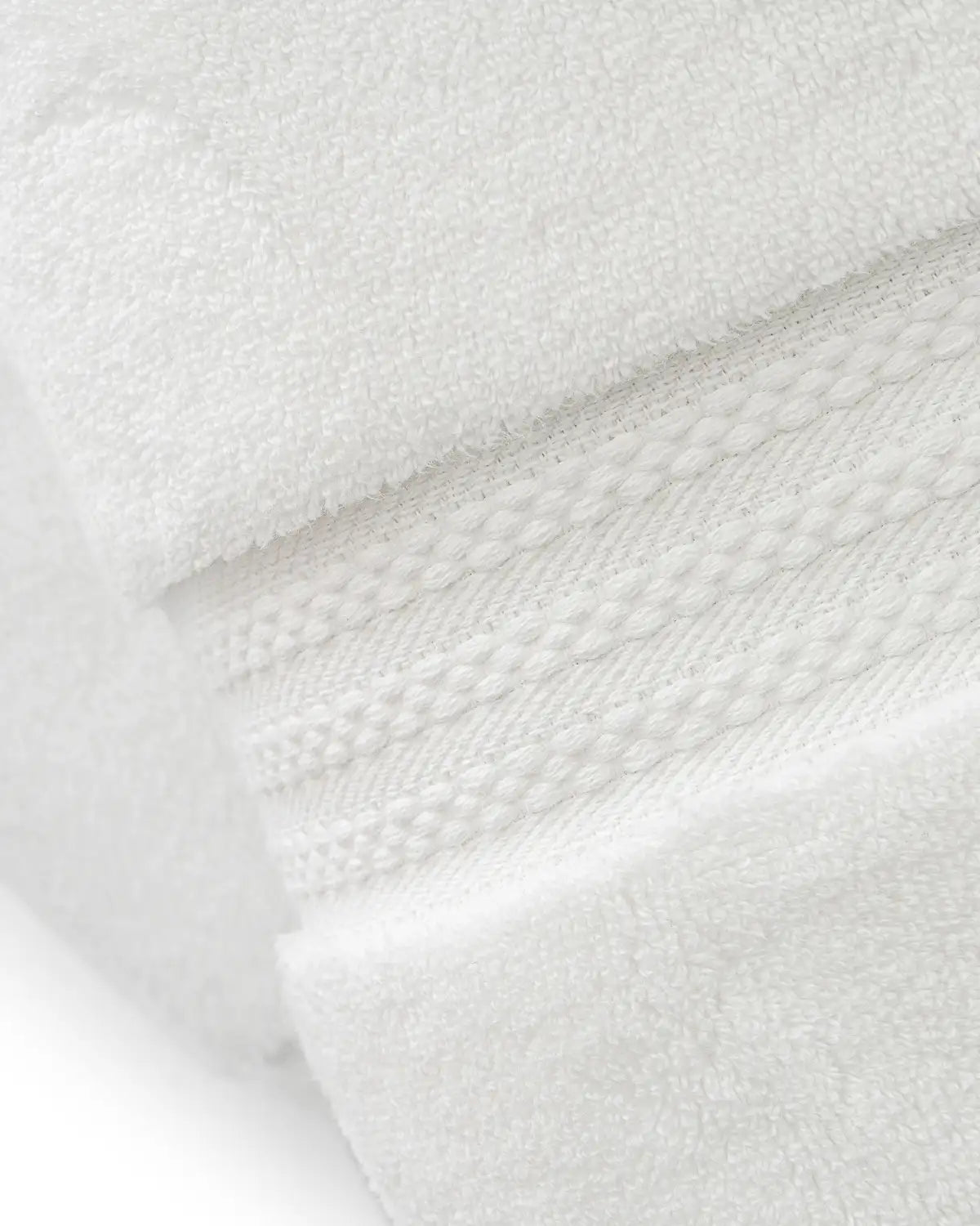 Close-up of white ultrasoft premium cotton towels