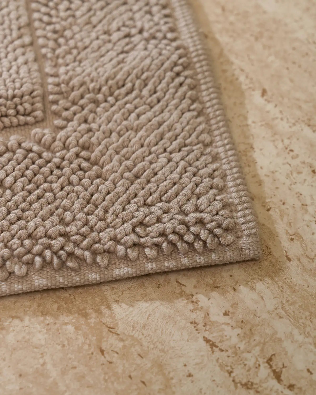 Close-up of a sandshell High-Density Cotton on a stone floor