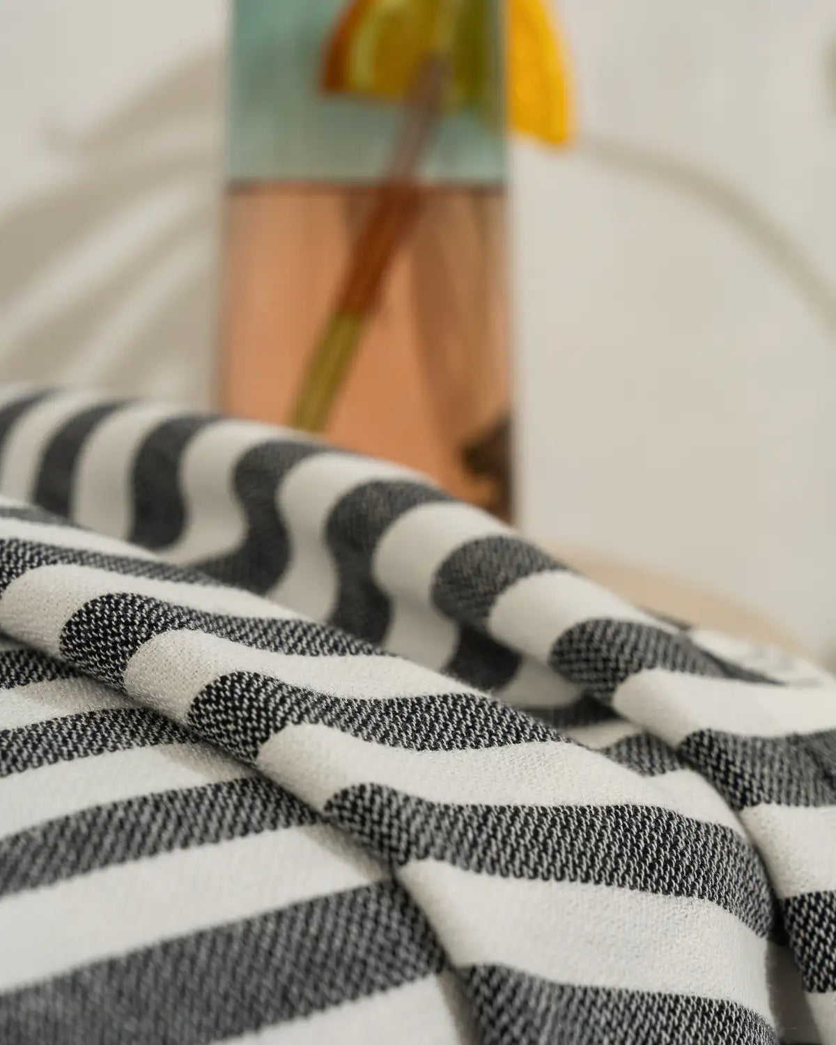 Close-up of a Ultra-Lightweight Multi-Purpose Beach Towel with a blurred background