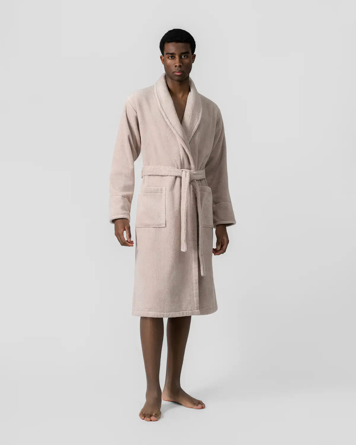 Man wearing a sandshell ultrasoft bathrobe on a white background