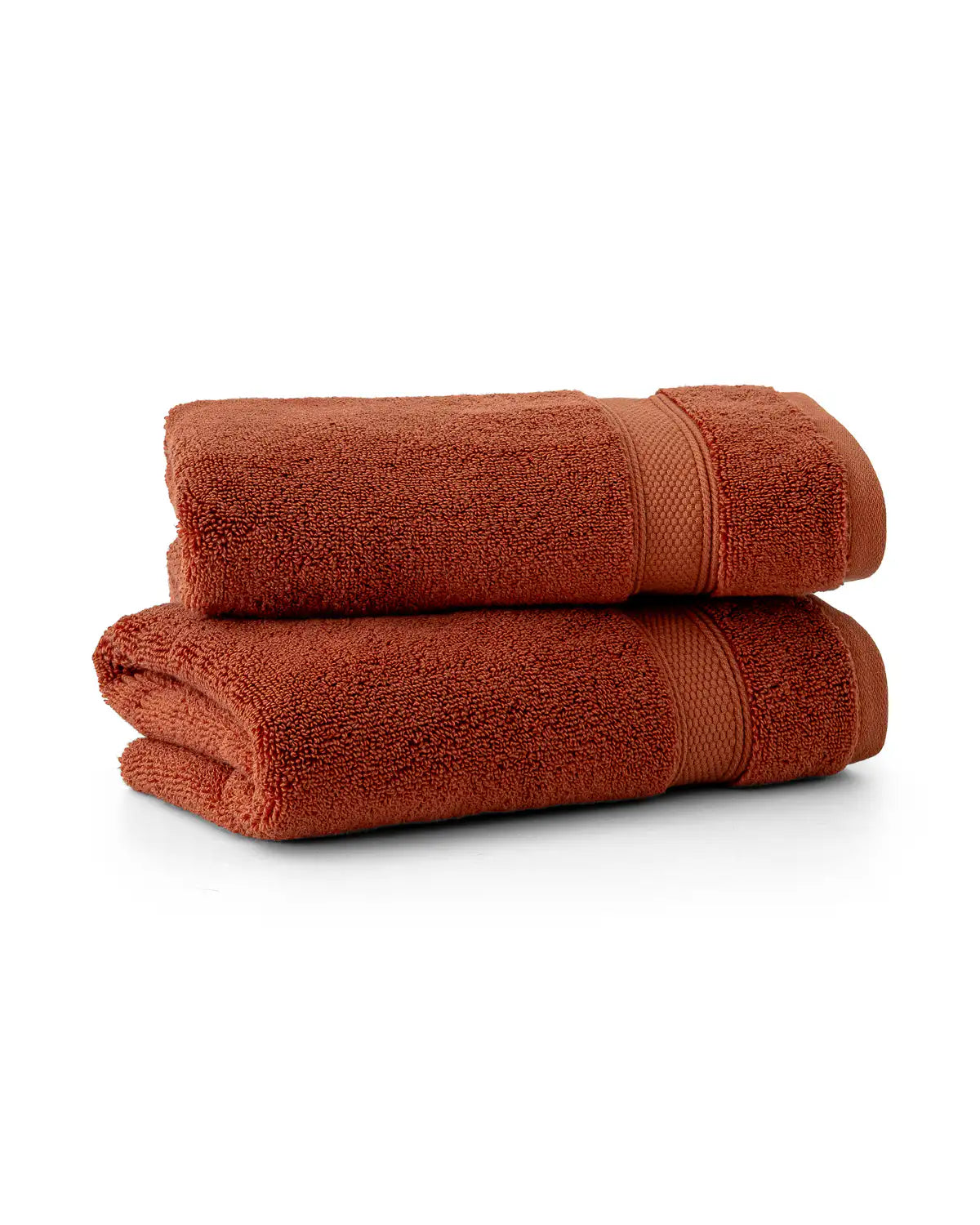 Two folded sienna Modal & Cotton washcloths on a white background